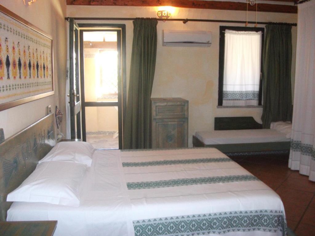 Hotel Fiore Di Maggio Villasimius Quarto foto